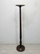 A C.1900 mahogany torchère. H.153cm.