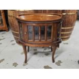 A 19th century style teak drinks or display cabinet fitted with a removable tray top. H.77 W.73cm.