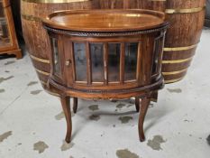 A 19th century style teak drinks or display cabinet fitted with a removable tray top. H.77 W.73cm.