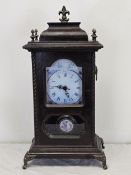A 19th century oak cased mantel clock with modern replacement movement. H.45 W.23cm.