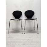 A pair of mid century Arne Jacobsen style stacking chairs. H.85 W.44 D.48cm.