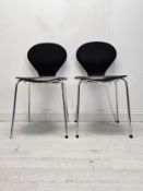 A pair of mid century Arne Jacobsen style stacking chairs. H.85 W.44 D.48cm.