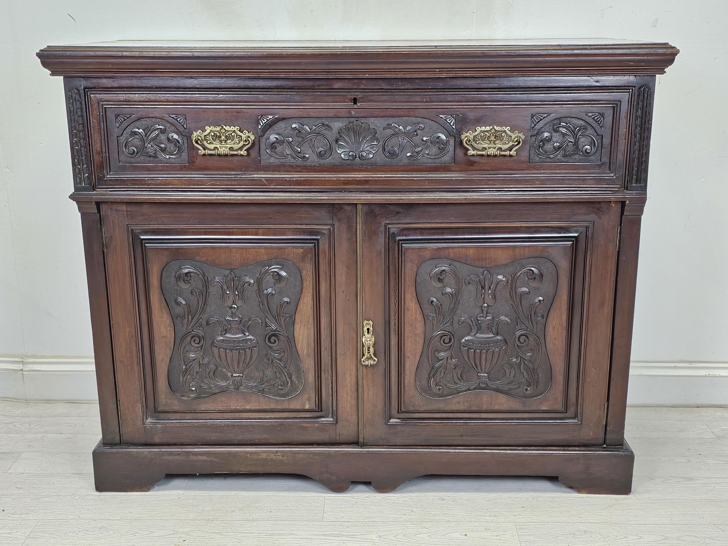 Secretaire cabinet, 19th century carved walnut with fall front revealing well fitted interior. H.100
