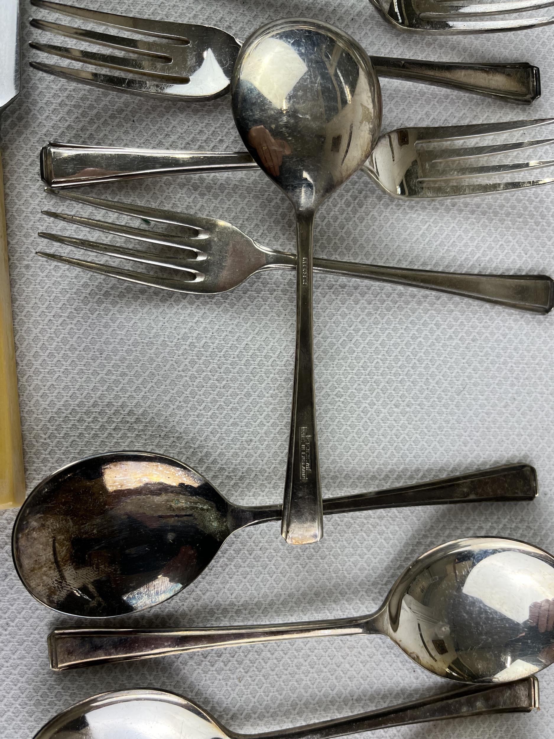 An extensive set of silver plated cutlery along with bone handled knives. - Image 3 of 6
