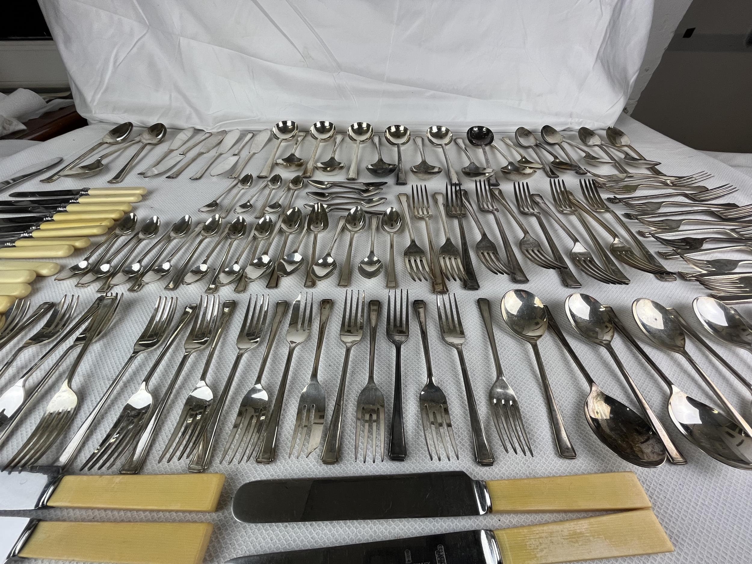 An extensive set of silver plated cutlery along with bone handled knives. - Image 6 of 6