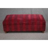A contemporary upholstered ottoman. H.43 W.120 D.58cm.