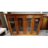 A contemporary glazed cabinet section. H.94 W.145 D.42cm.