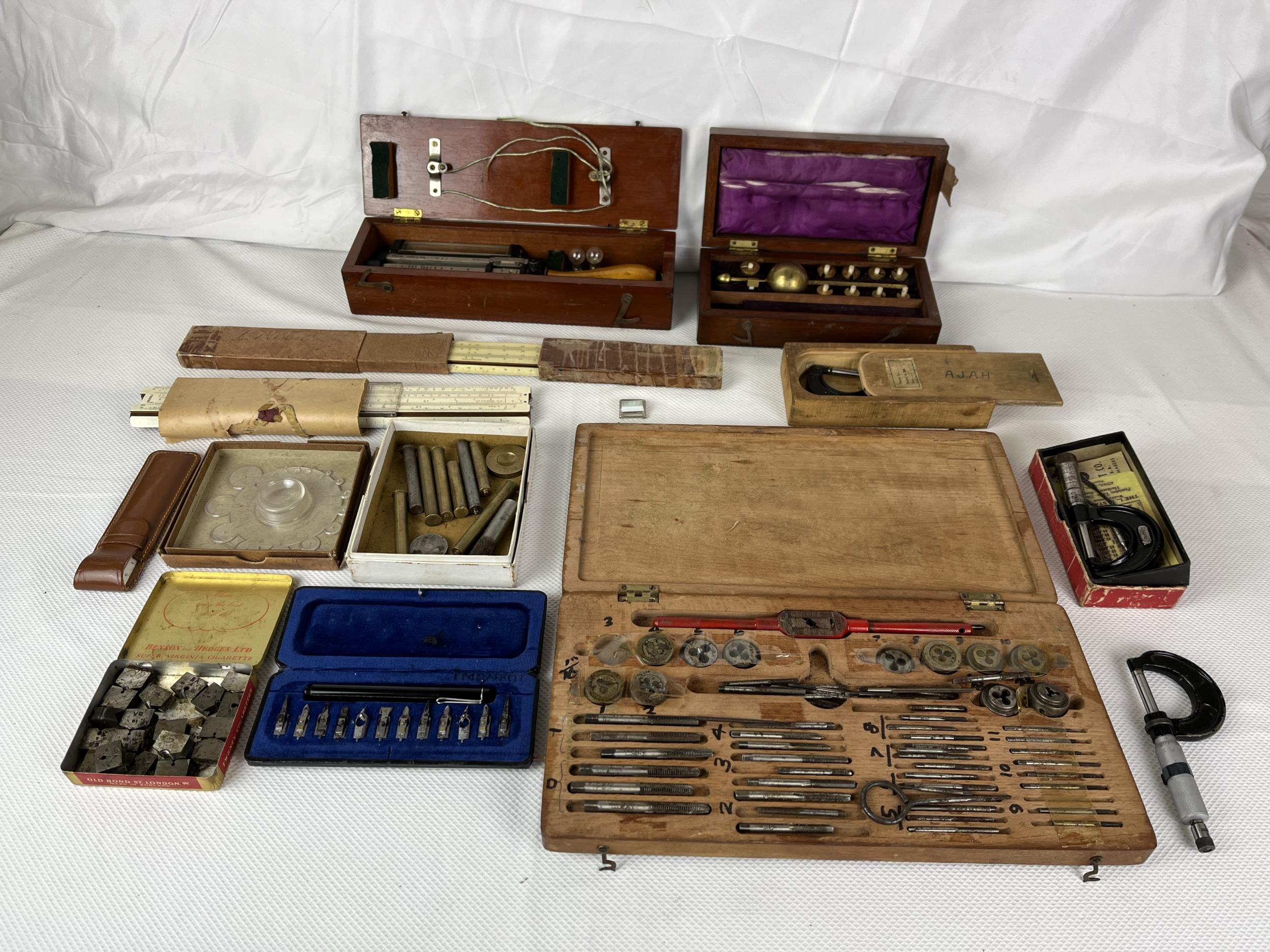 A miscellaneous collection of vintage tools and engineering equipment.