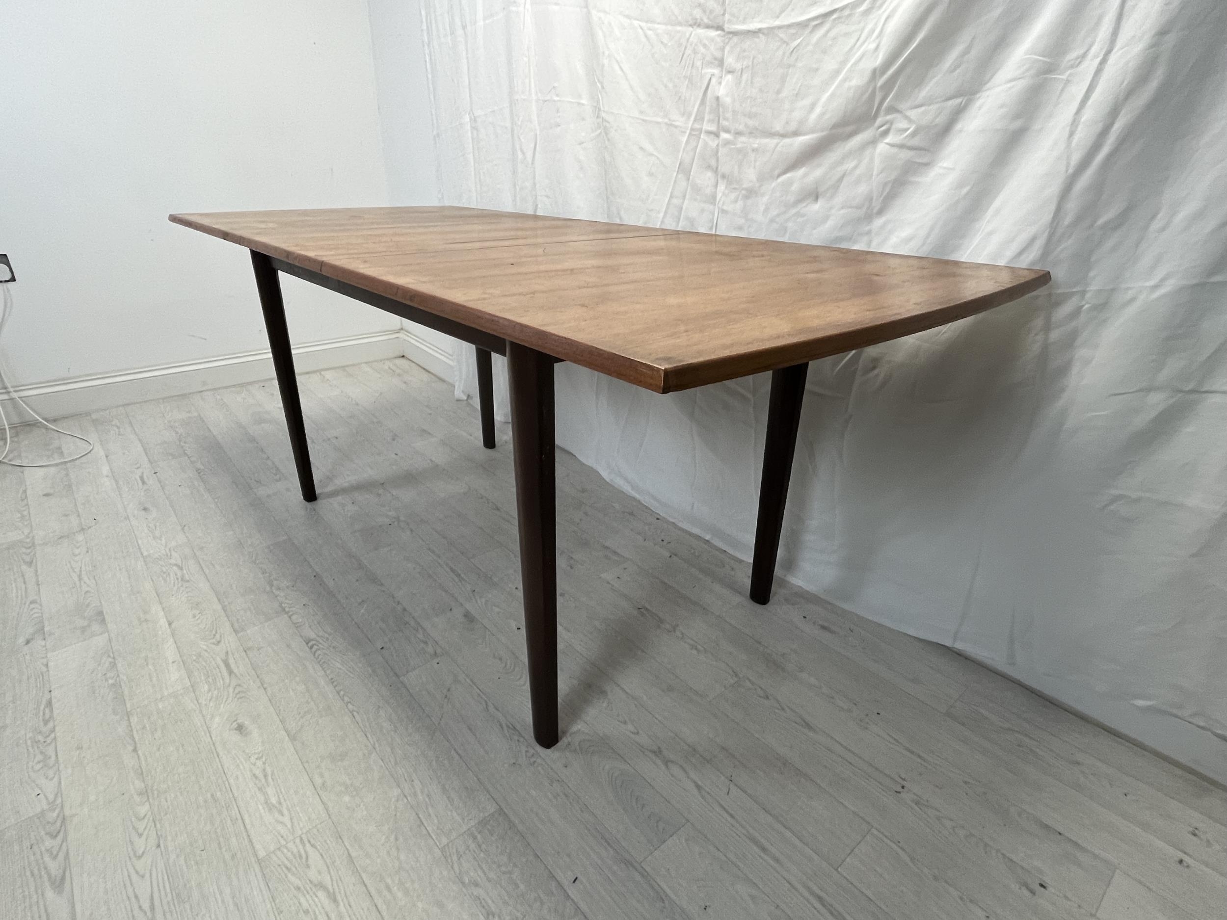 Dining table, possibly Gordon Rusell, mid century teak fitted with integral extension leaf. H.76 W. - Image 6 of 8