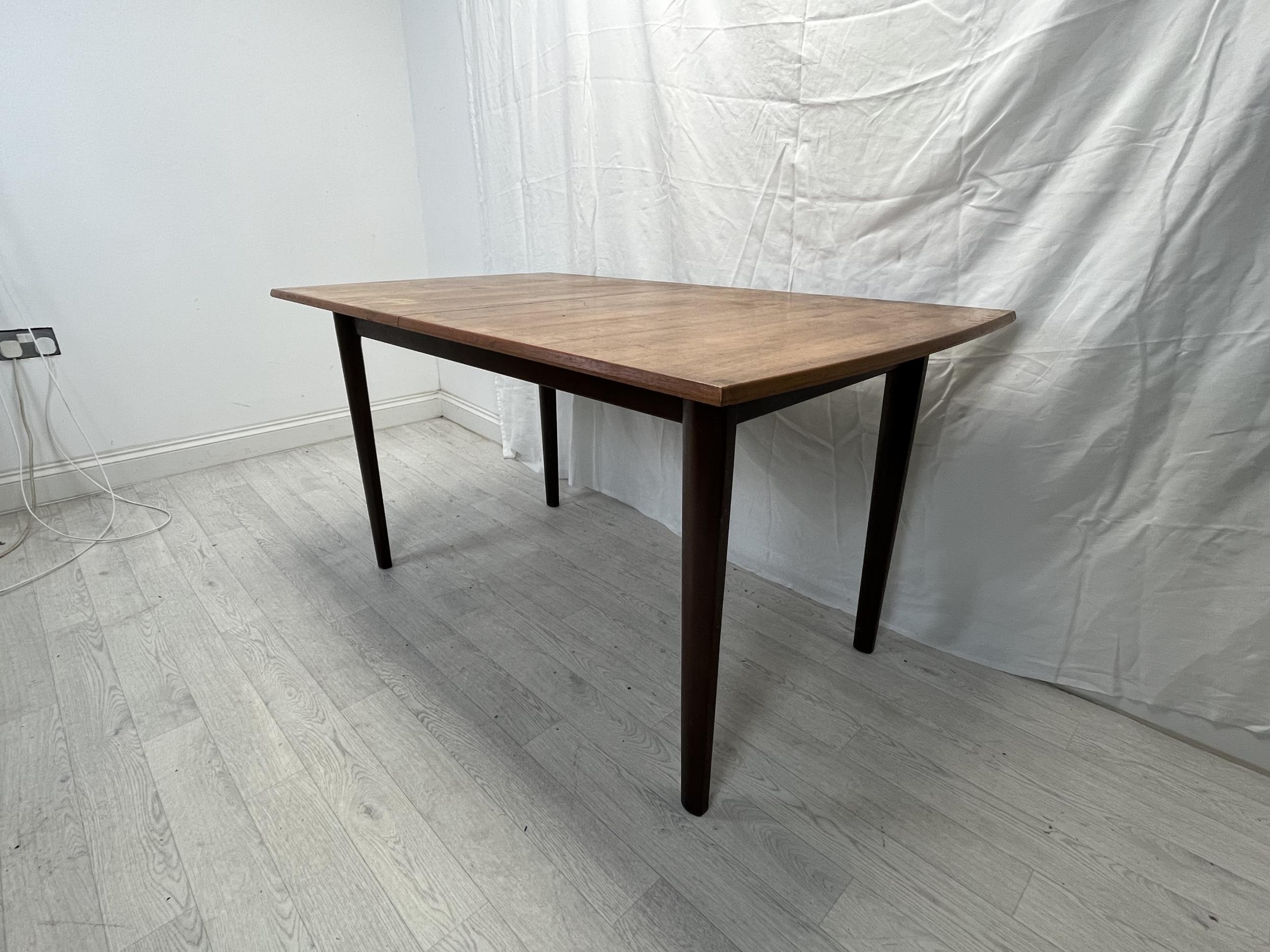 Dining table, possibly Gordon Rusell, mid century teak fitted with integral extension leaf. H.76 W. - Image 2 of 8