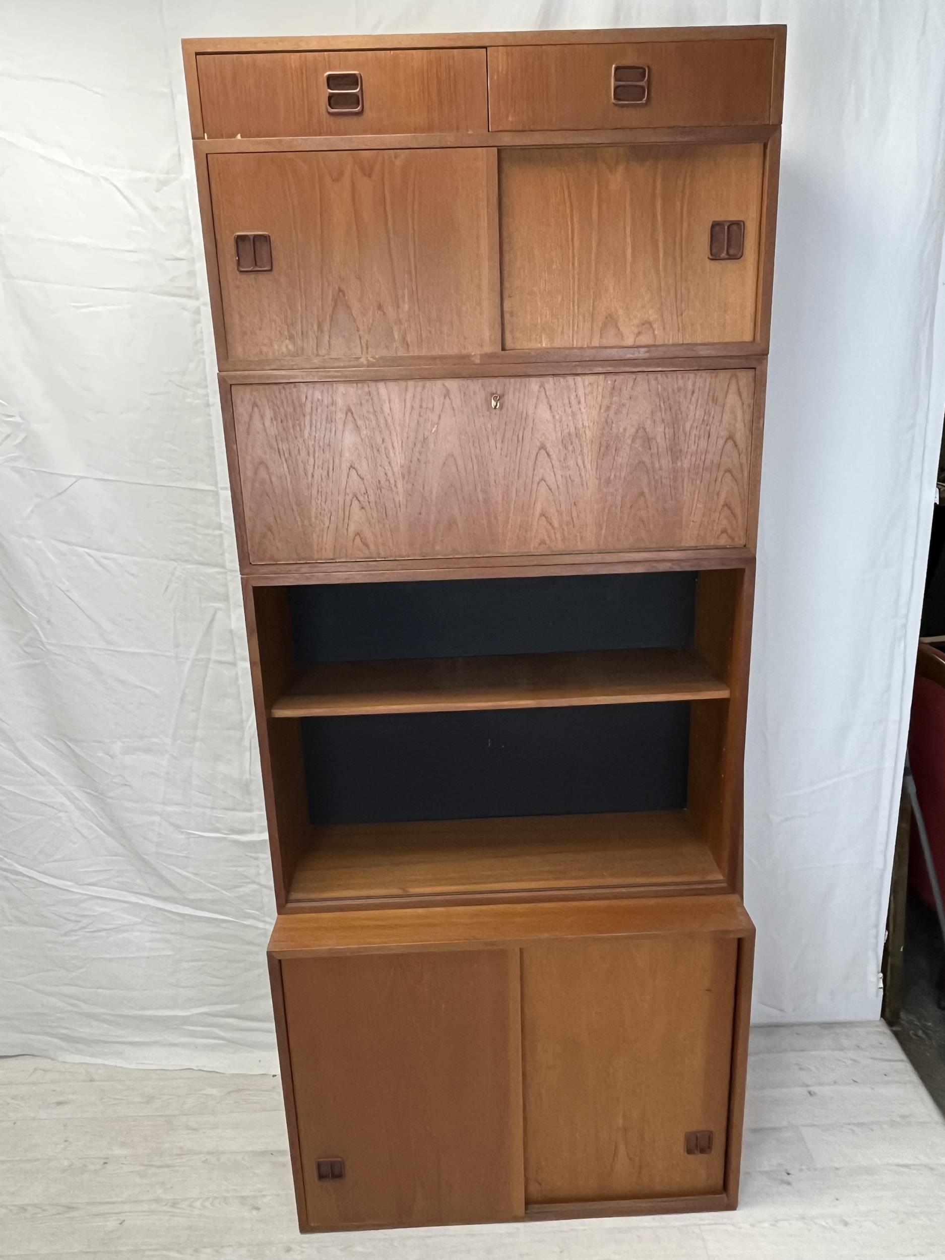 A mid century teak stacking cabinet in five sections. H.196 W.88 D.40cm.