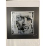 An overlaid photographic type print on aluminium and floated on a black mount. Signed