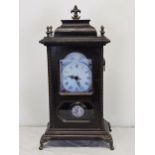 A 19th century oak cased mantel clock with modern replacement movement. H.45 W.23cm.