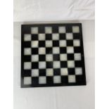 An onyx and marble chess board. 37cm.