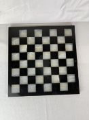 An onyx and marble chess board. 37cm.