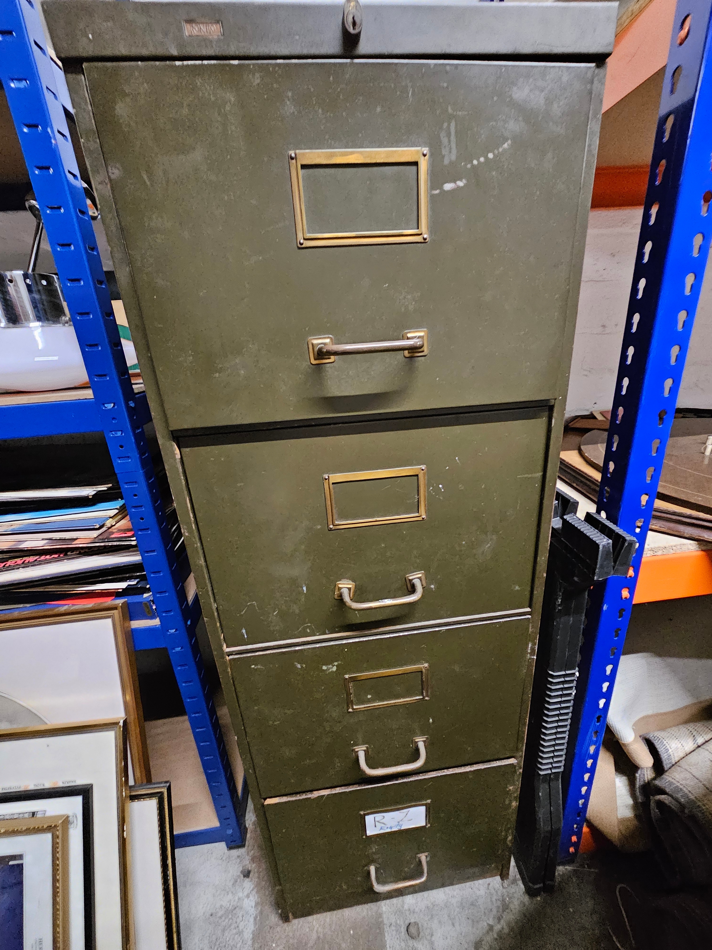 A vintage metal and brass filing cabinet. H.130 W.50 D.63cm.
