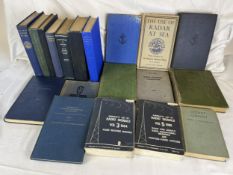 A collection of vintage naval books and manuals.