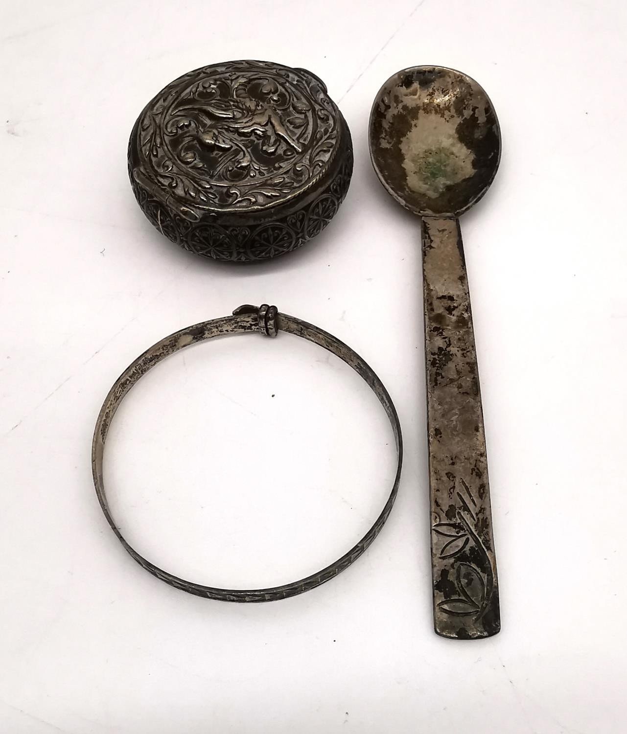 A collection of silver and white metal items, including a silver tea spoon, a silver baby bangle, - Image 13 of 18