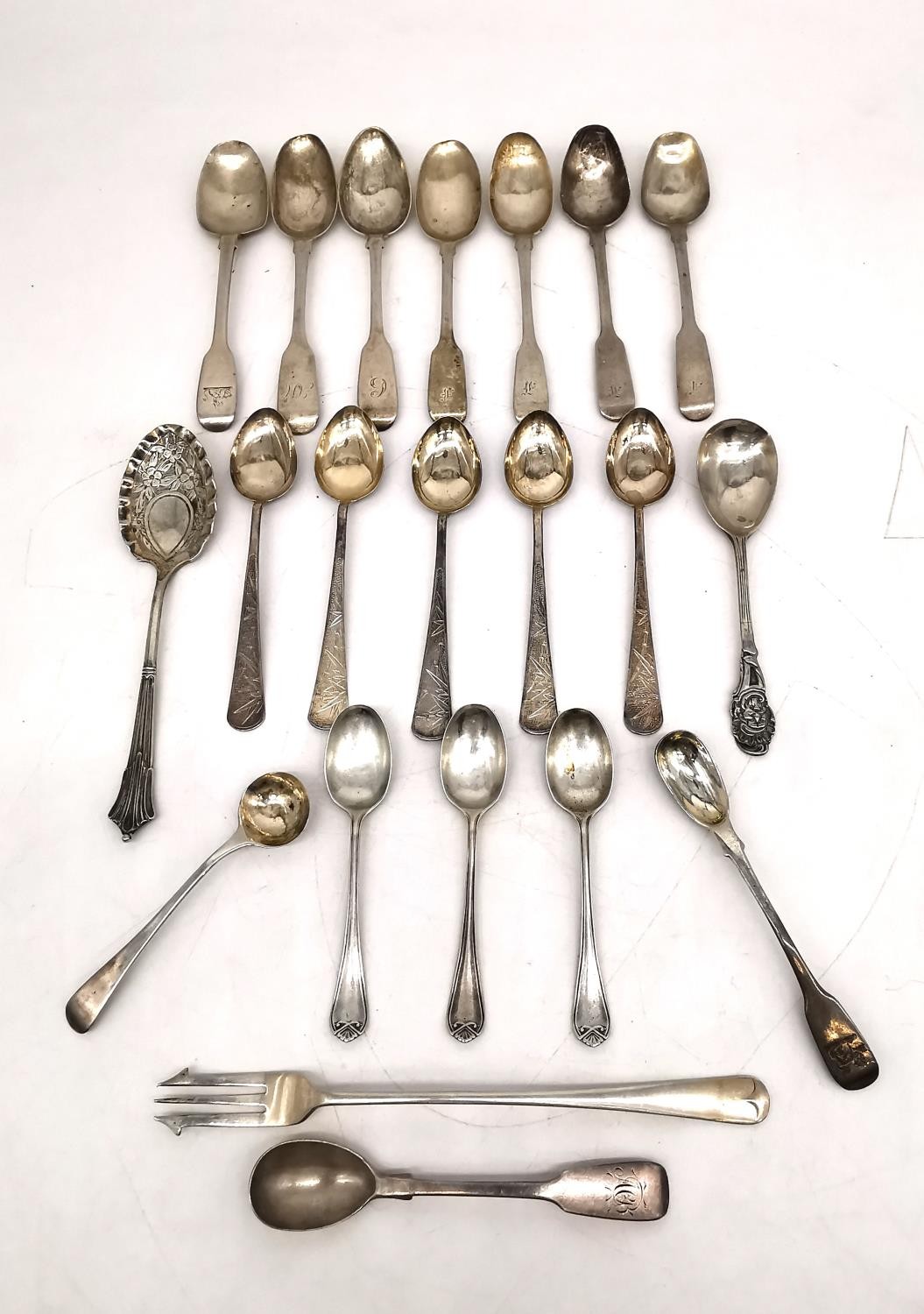 A collection of 18th and 19th century silver cutlery, including five matching bright cut