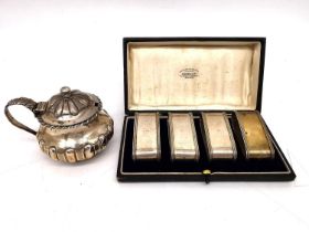 A fitted leather cased set of four silver napkin rings by Stokes & Ireland Ltd numbered 1 to 4 and a