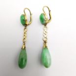 A pair of early 20th century Chinese yellow metal (tests as 14ct gold) and jade drop earrings. Set