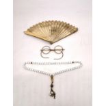 A pair of early 20th century leather cased 10ct gold plated spectacles along with a white glass
