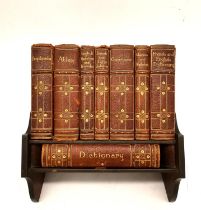 An early 20th century desk library by Asprey of London with complete set of leather bound books.