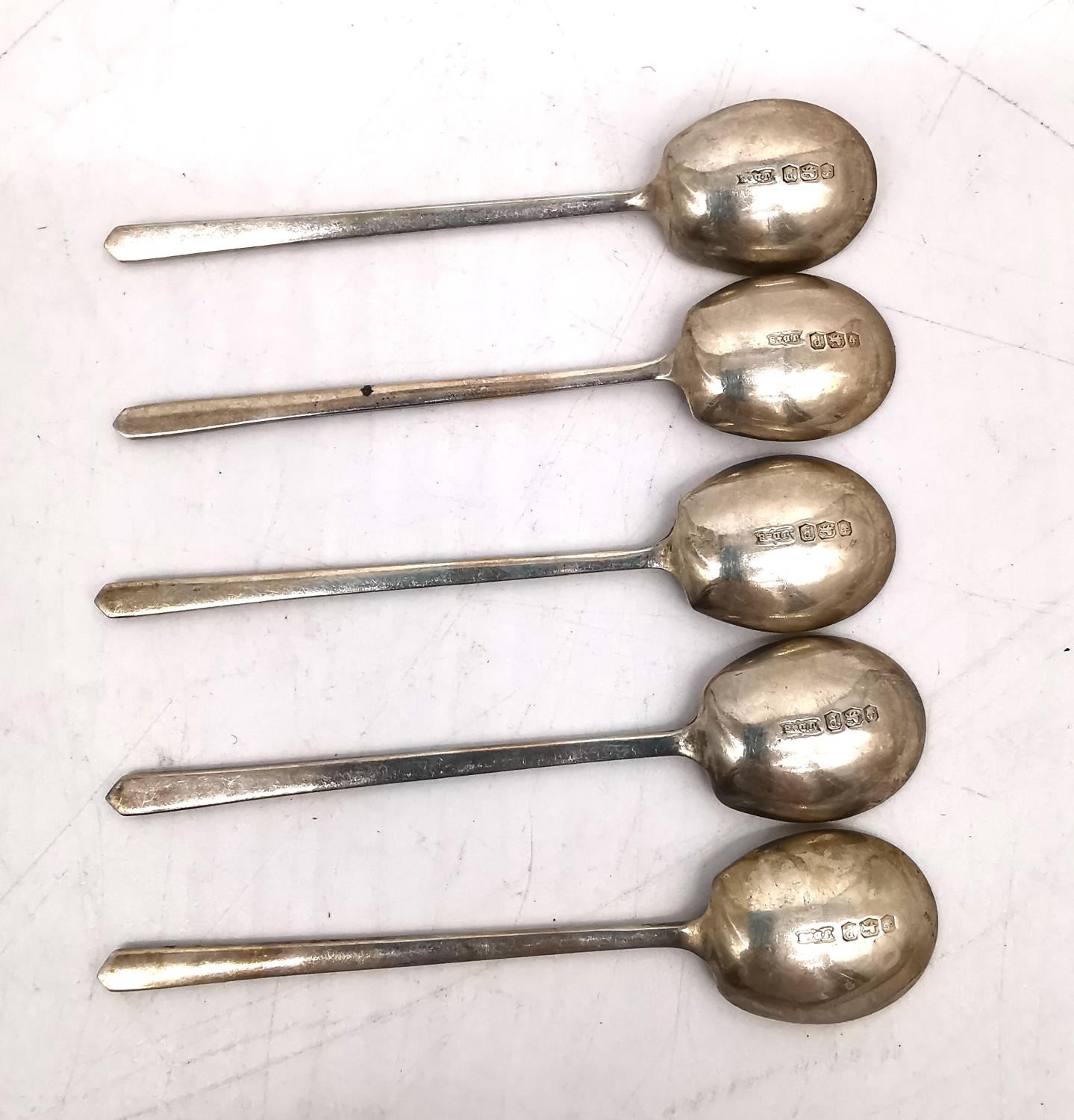 A leather cased set of six silver coffee spoons, six repousse silver teaspoons and five Art Deco - Image 6 of 10