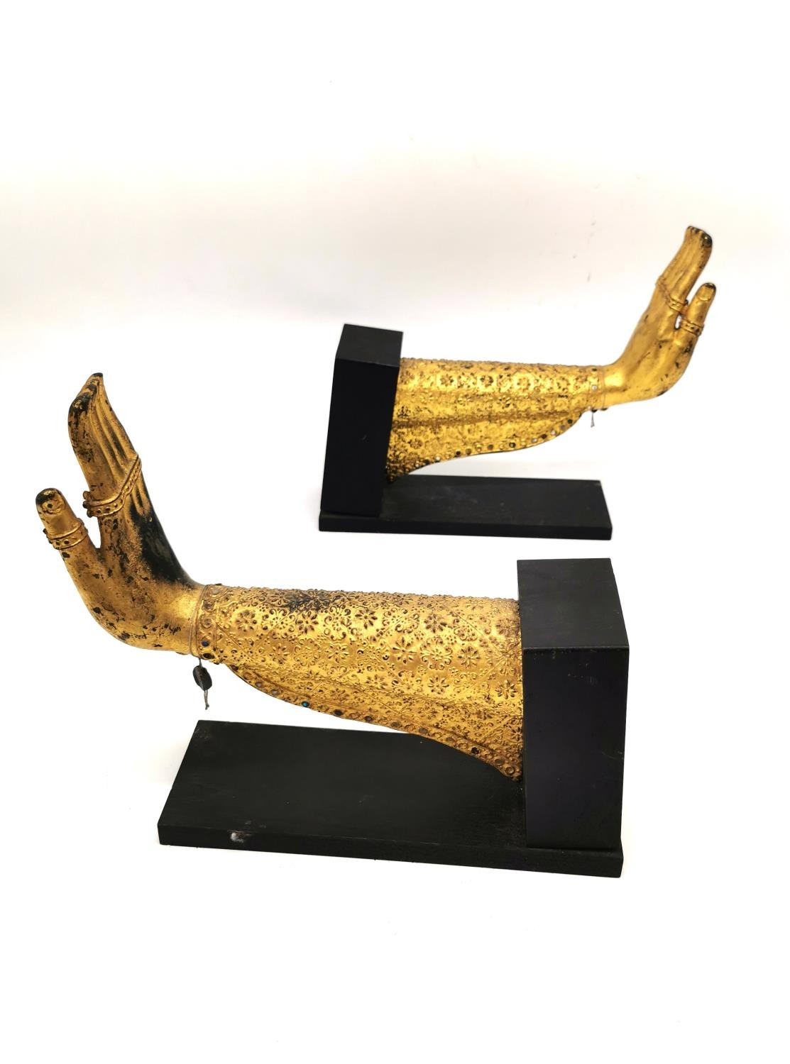 A pair of Thai 19th century gilt bronze Buddha hands with coloured mirrored mosaic tile detailing,