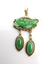 A Chinese 14 carat yellow gold an Jade articulated pendant. The central pendant a carved jade