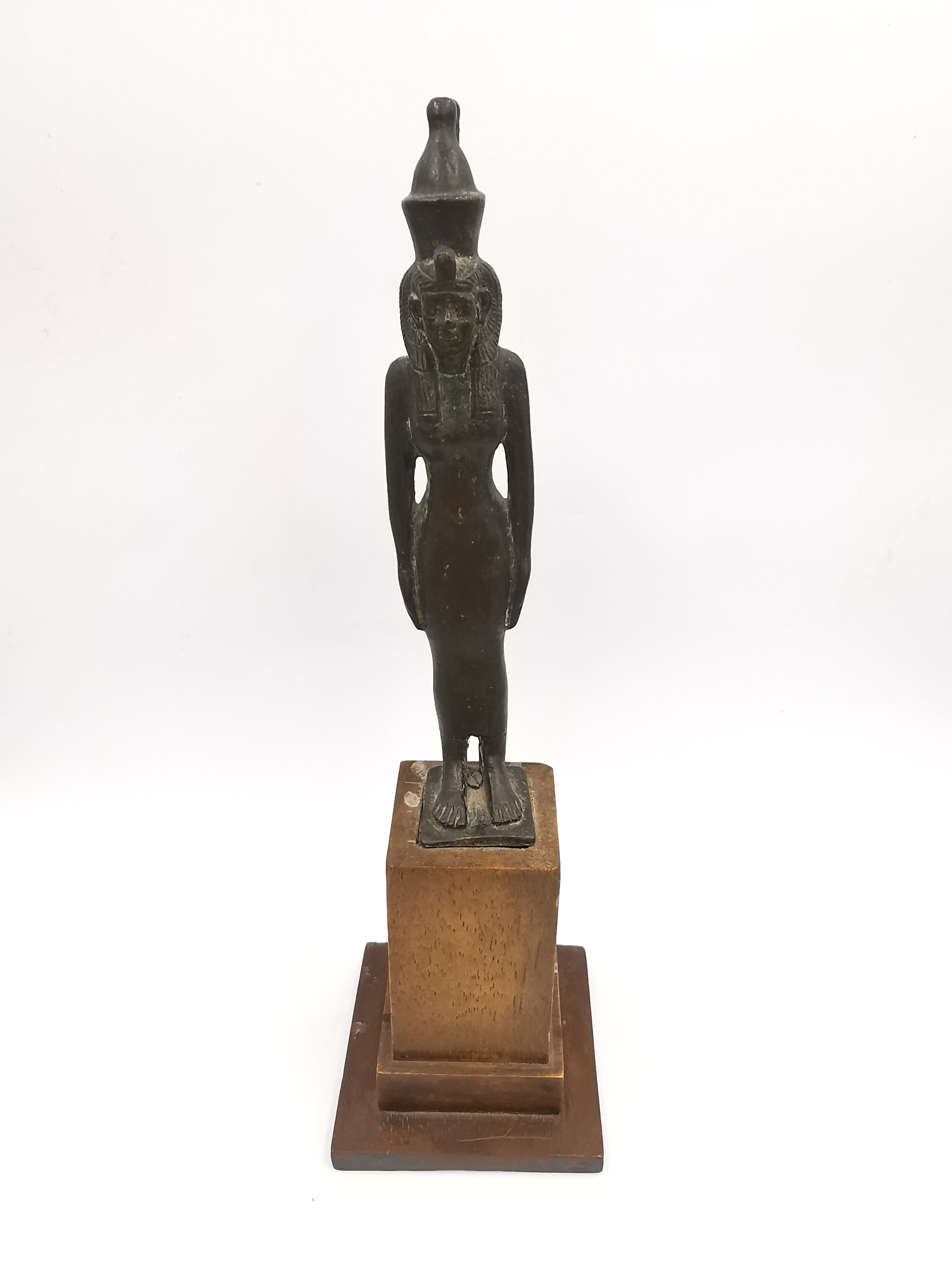 A 19th century Egyptian style bronze statue of an Egyptian god mounted on a wooden stand. H.20cm.