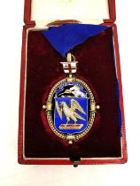 A leather fitted cased white metal (tests as silver) and enamel Master of Scriveners guild medal. '