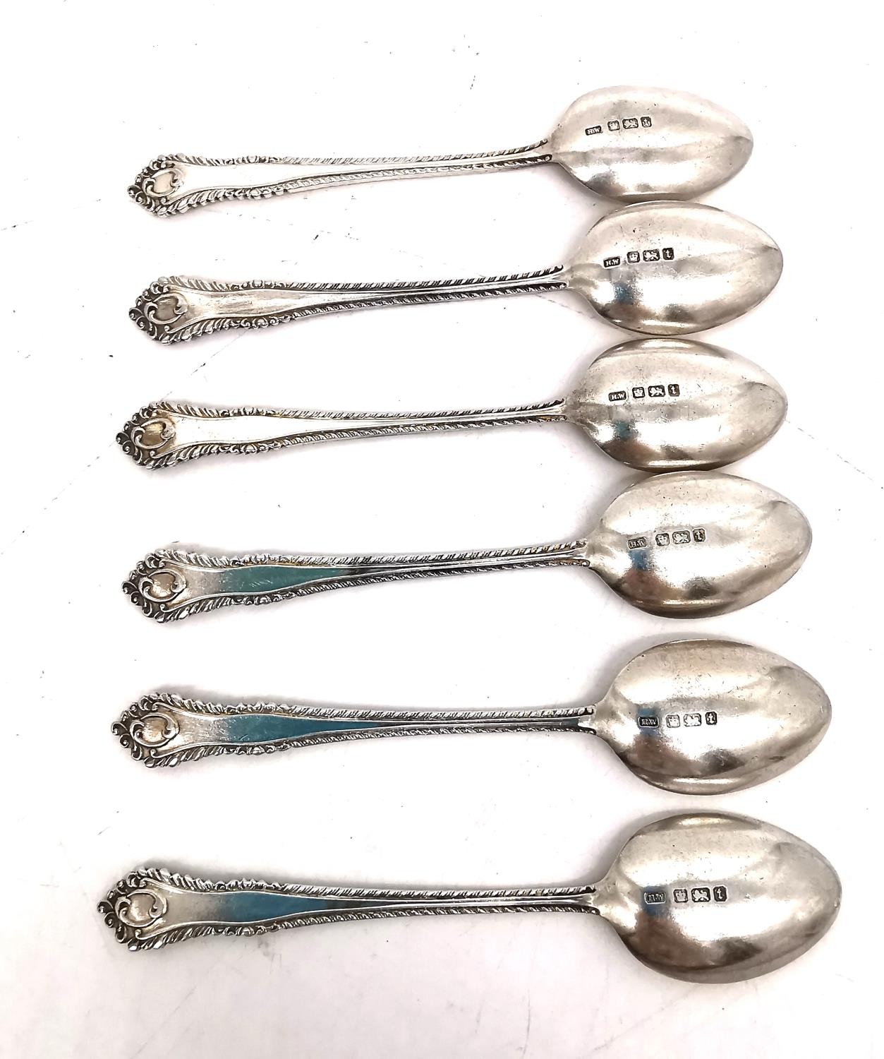 A leather cased set of six silver coffee spoons, six repousse silver teaspoons and five Art Deco - Image 4 of 10