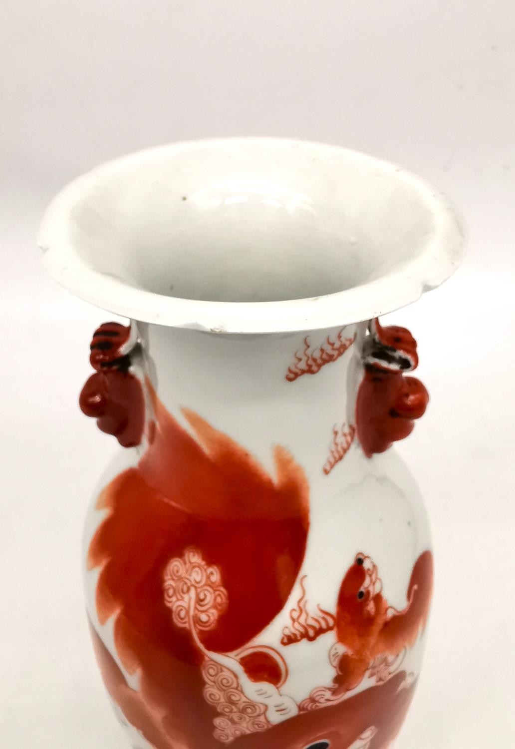 A Chinese iron red 'Buddhist lion vase. Decorated with two fu lion form handles and the body hand - Image 10 of 12