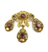 A 19th century Austrian yellow metal (tests as 18ct gold) filigree wirework and garnet set