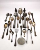 A collection of silver and white metal cutlery and dinnerware, including a large silver serving