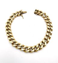 An 18 carat yellow solid curb link bracelet with hidden push clasp and safety catch. Stamped 750