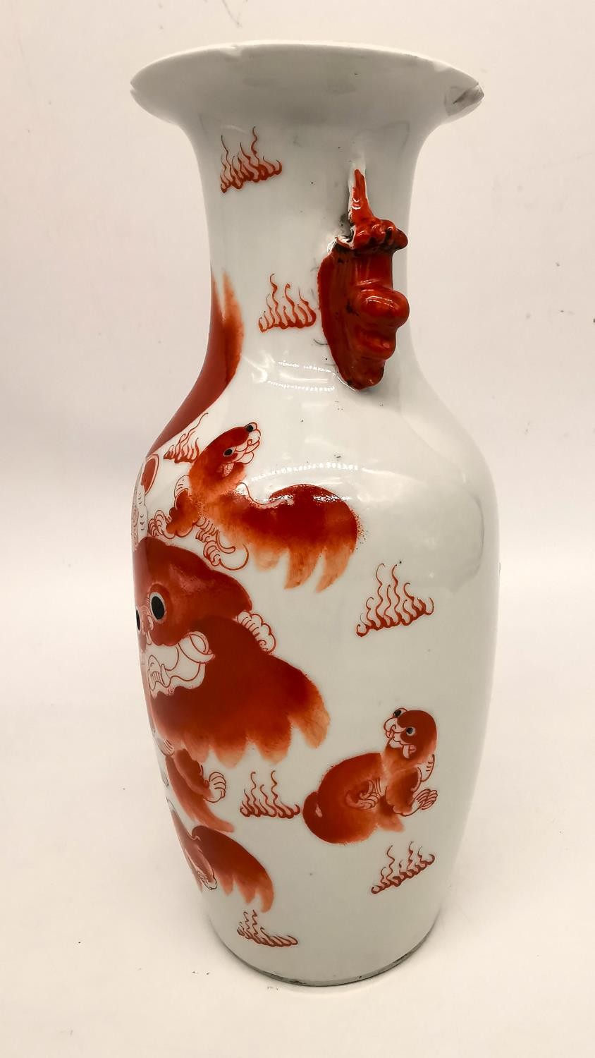 A Chinese iron red 'Buddhist lion vase. Decorated with two fu lion form handles and the body hand - Image 6 of 12