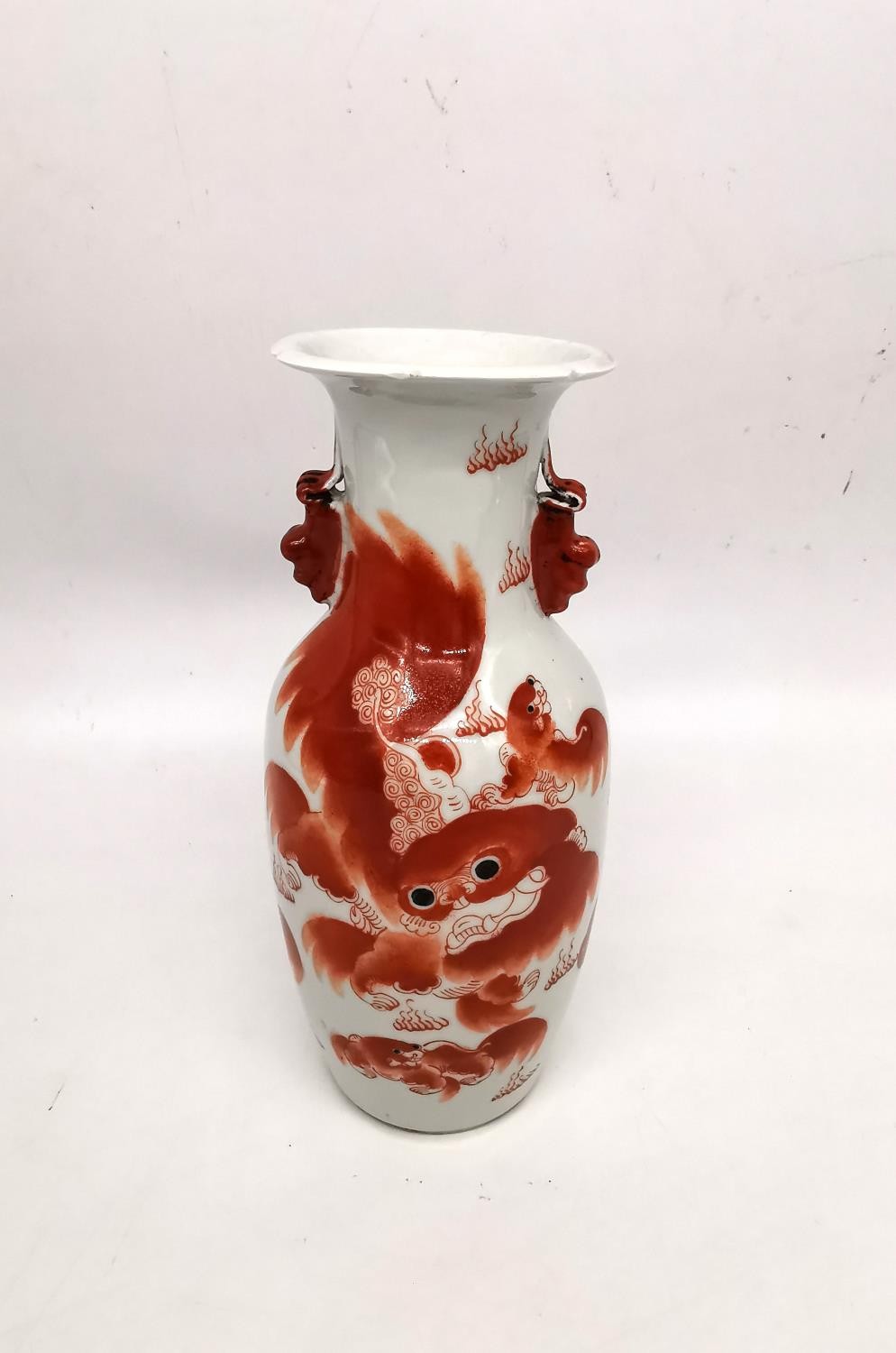 A Chinese iron red 'Buddhist lion vase. Decorated with two fu lion form handles and the body hand - Image 3 of 12