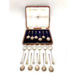 A leather cased set of six silver coffee spoons, six repousse silver teaspoons and five Art Deco