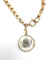 An Austrian 14 carat rose gold double portrait locket and fancy link chain with albert clasp. The