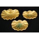 A set of three heavy gilt metal card trays or soap dishes of scalloped form. L.23 W.15cm. (Largest).