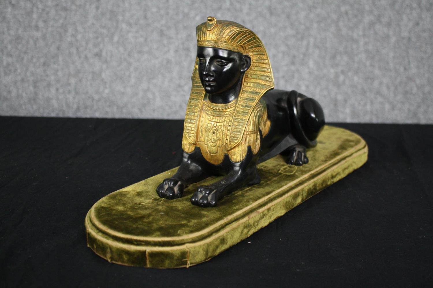 A Grand Tour Egyptian Revival spelter and gilt figure of a recumbent Sphinx. H.20 W.43 D.14cm. - Image 3 of 5