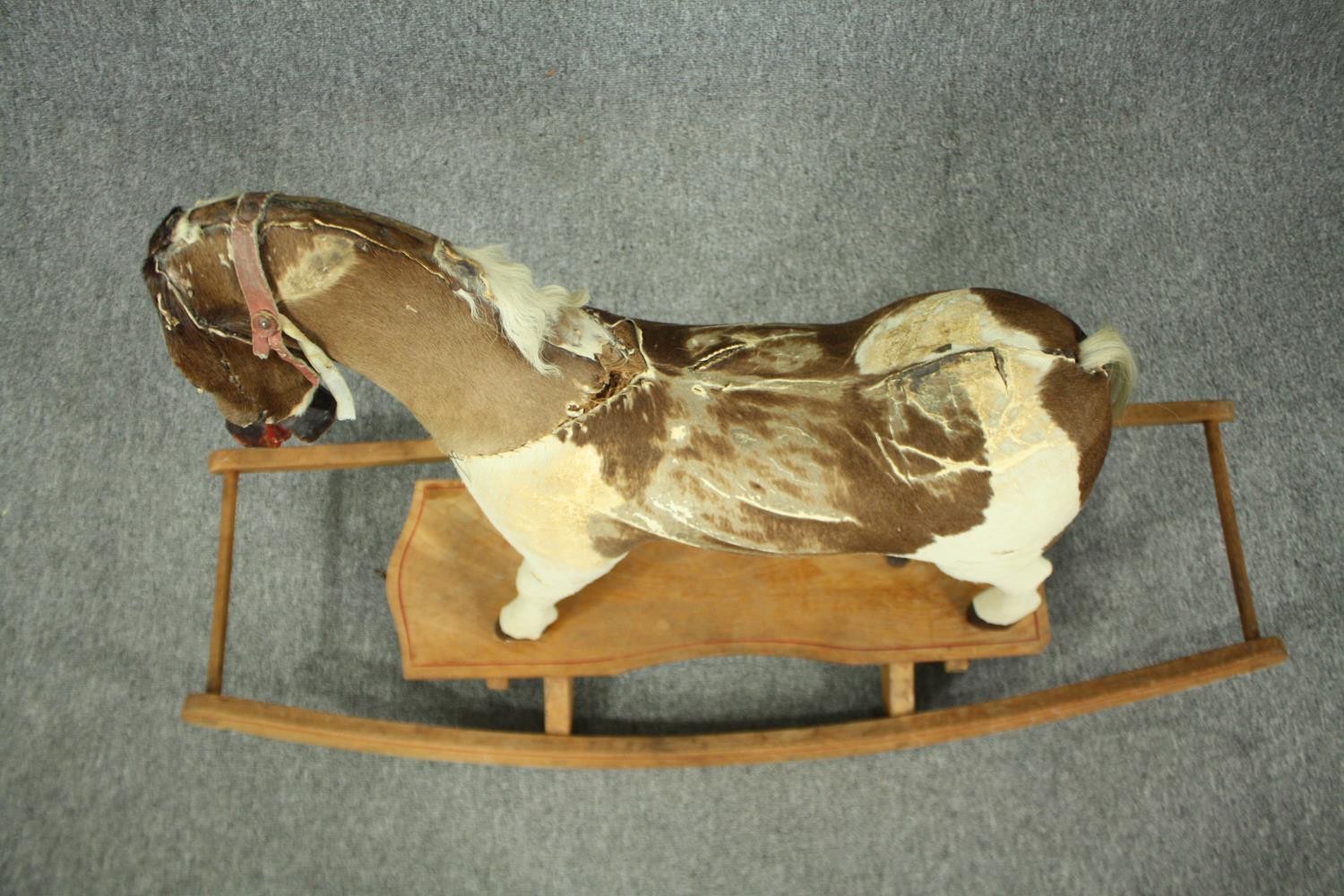 A vintage rocking horse in cowhide covering. H.74 W.110 D.38cm. - Image 3 of 14