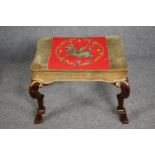 A Georgian walnut and gilt footstool with tapestry upholstered seat on cabriole supports. H.50 W.