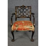 A Chinese Chippendale style lacquered armchair hand decorated in gilt. H.80cm.