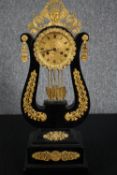 Mantel clock, 19th century ebonised and ormolu. H.52 W.20 D.12cm.