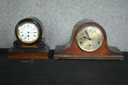 A 19th century ebonised and mahogany mantel clock along with a later clock. H.23 W.42cm. (largest)