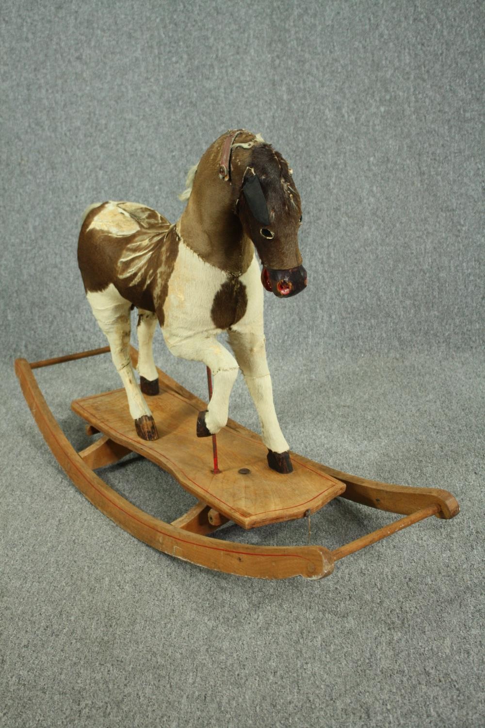 A vintage rocking horse in cowhide covering. H.74 W.110 D.38cm. - Image 5 of 14