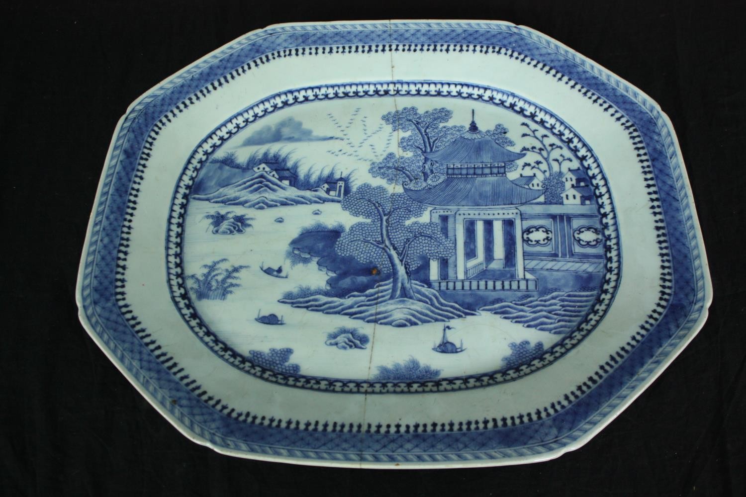 A 19th century blue and white meat plate. L.51 W.43cm. (With old crack as seen).